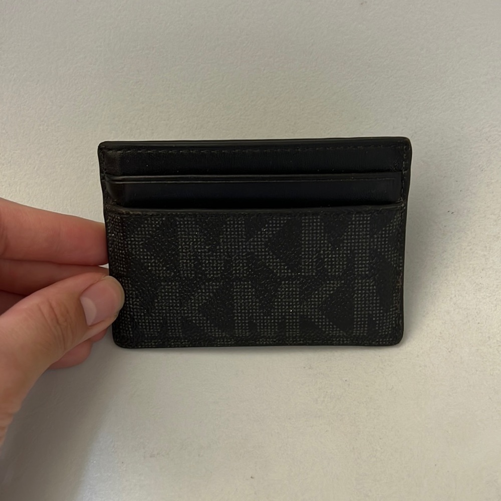 Michael Kors black men & women’s monogram wallet